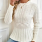 Dames trui met dikke steken, ronde hals en peplum