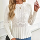 Dames trui met dikke steken, ronde hals en peplum