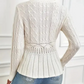 Dames trui met dikke steken, ronde hals en peplum