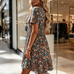 Zomerse Damesjurk met Bloemenprint, V-hals en Korte Mouwen